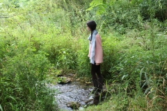 Erica's Senior Photos by a stream.